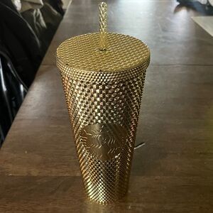 Gold Starbucks cup